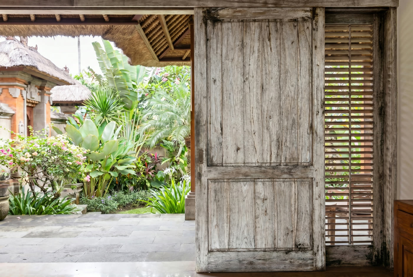 Sun-bleached, weathered teak door before restoration